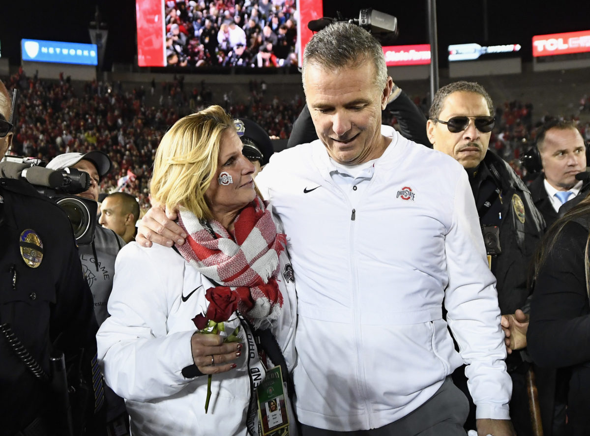 urban meyer and his wife shelley meyer after the rose bowl