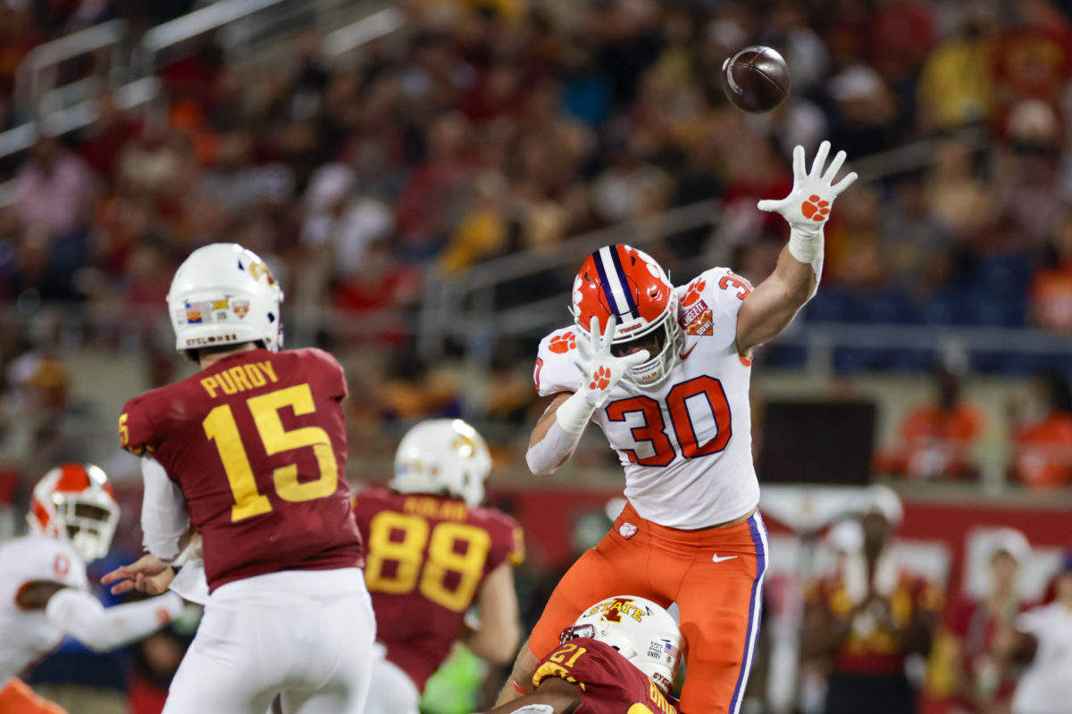 Clemson linebacker Keith Maguire attempts to block a pass during the Cheez-It Bowl against Iowa State.