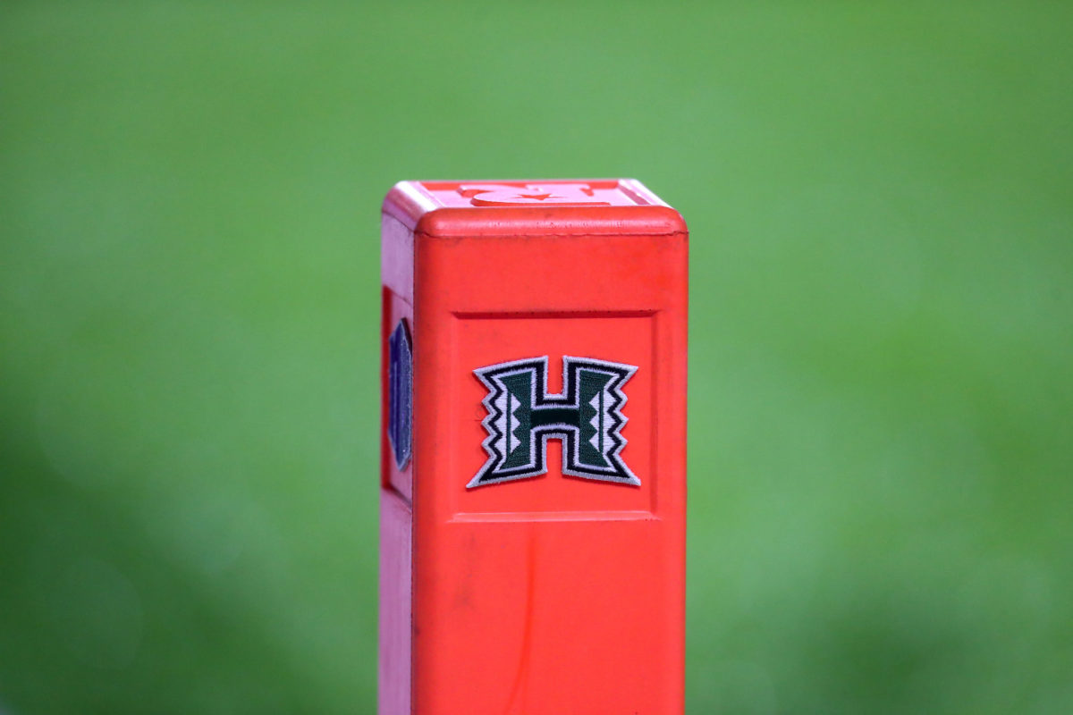 A football pylon with the University of Hawaii logo on it.
