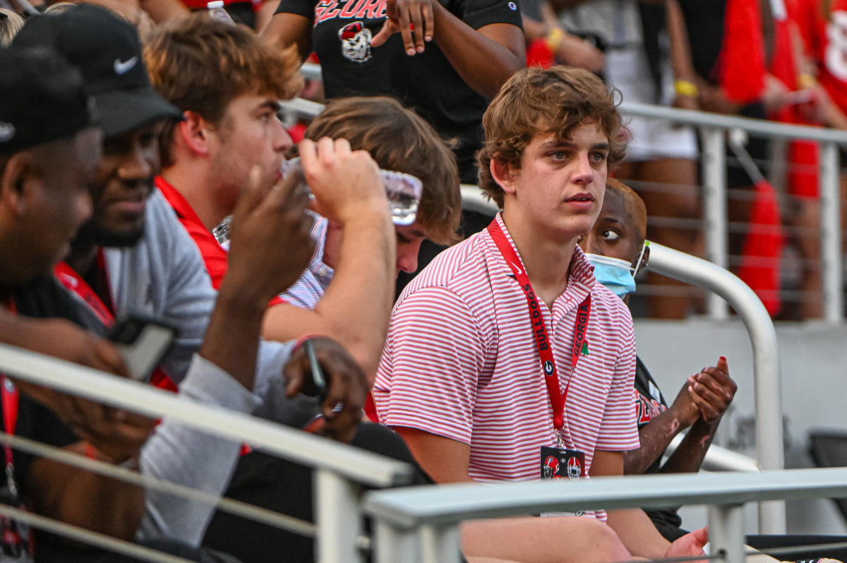Arch Manning watching a Georgia game in the stands.