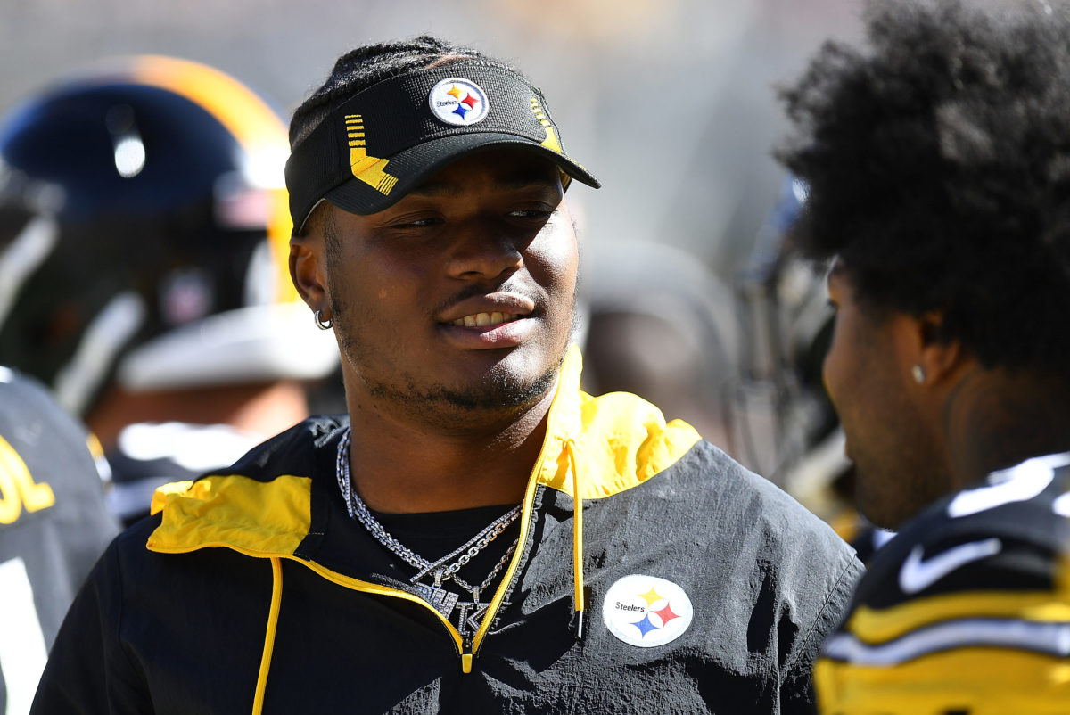 Steelers quarterback Dwayne Haskins looks on from the sidelines during a game.