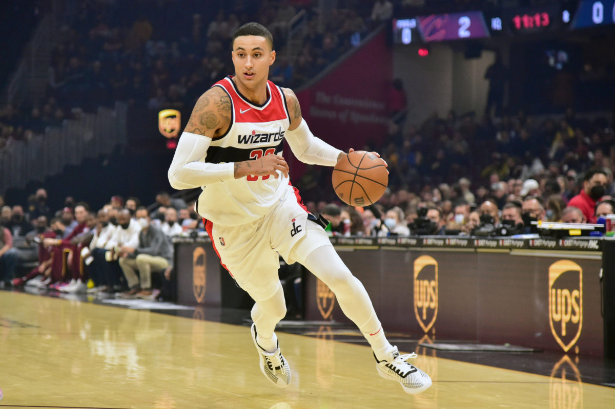 Wizards forward Kyle Kuzma drives to the basket, dribbling with his left hand.