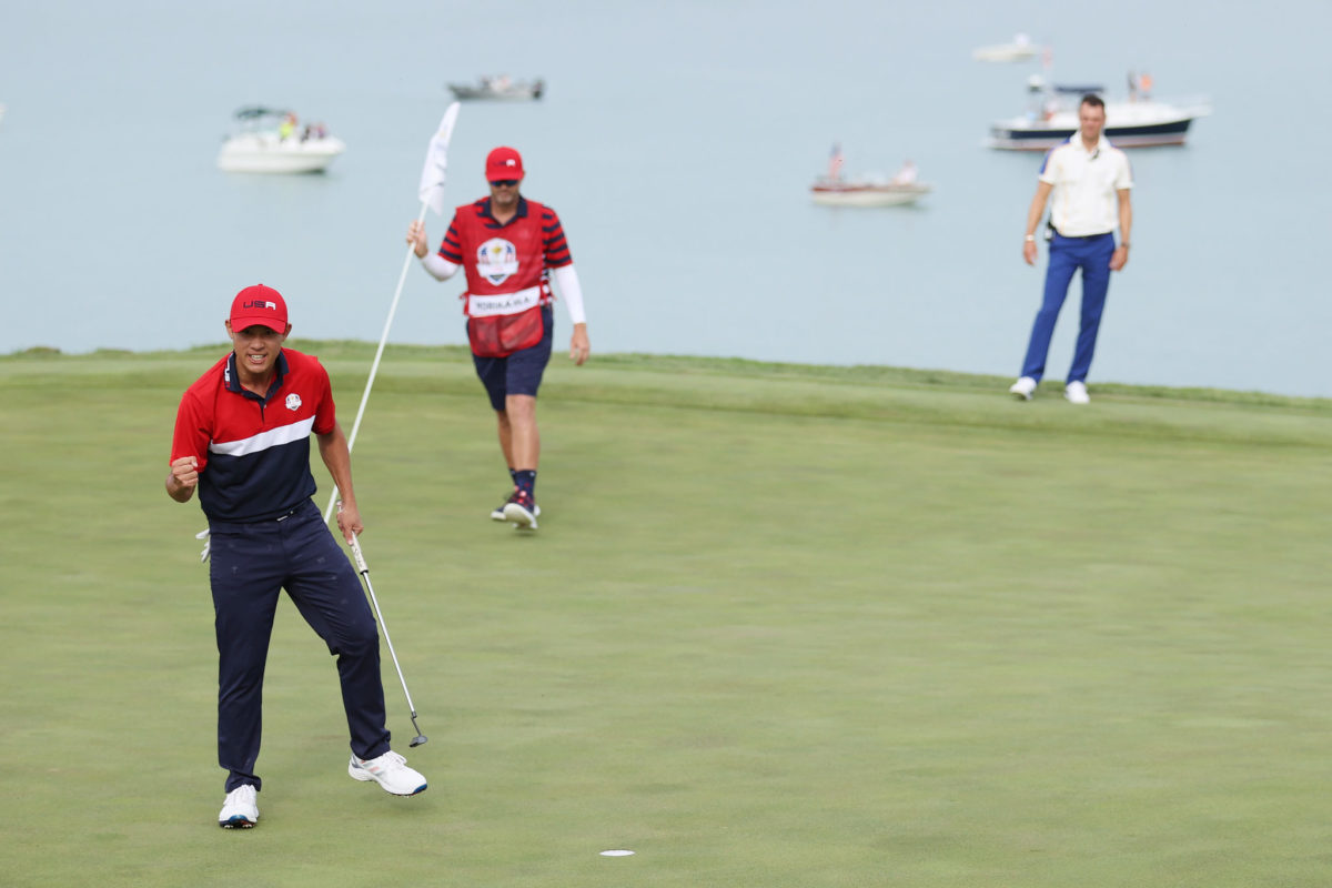 Collin Morikawa celebrates after clinching the Ryder Cup victory for Team USA.