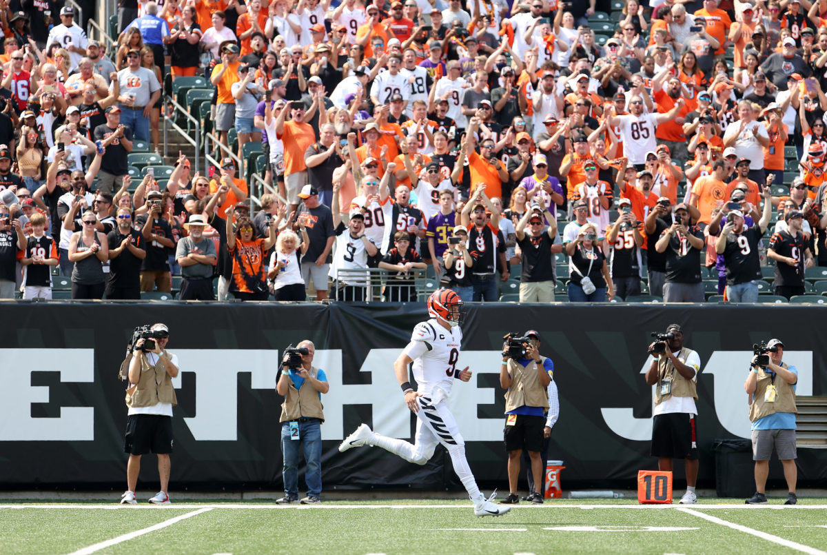 Joe Burrow runs on the field during introductions before a Bengals home game.
