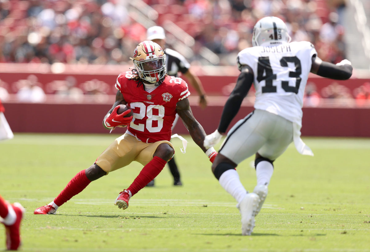 49ers running back Trey Sermon carries the ball against the Raiders.