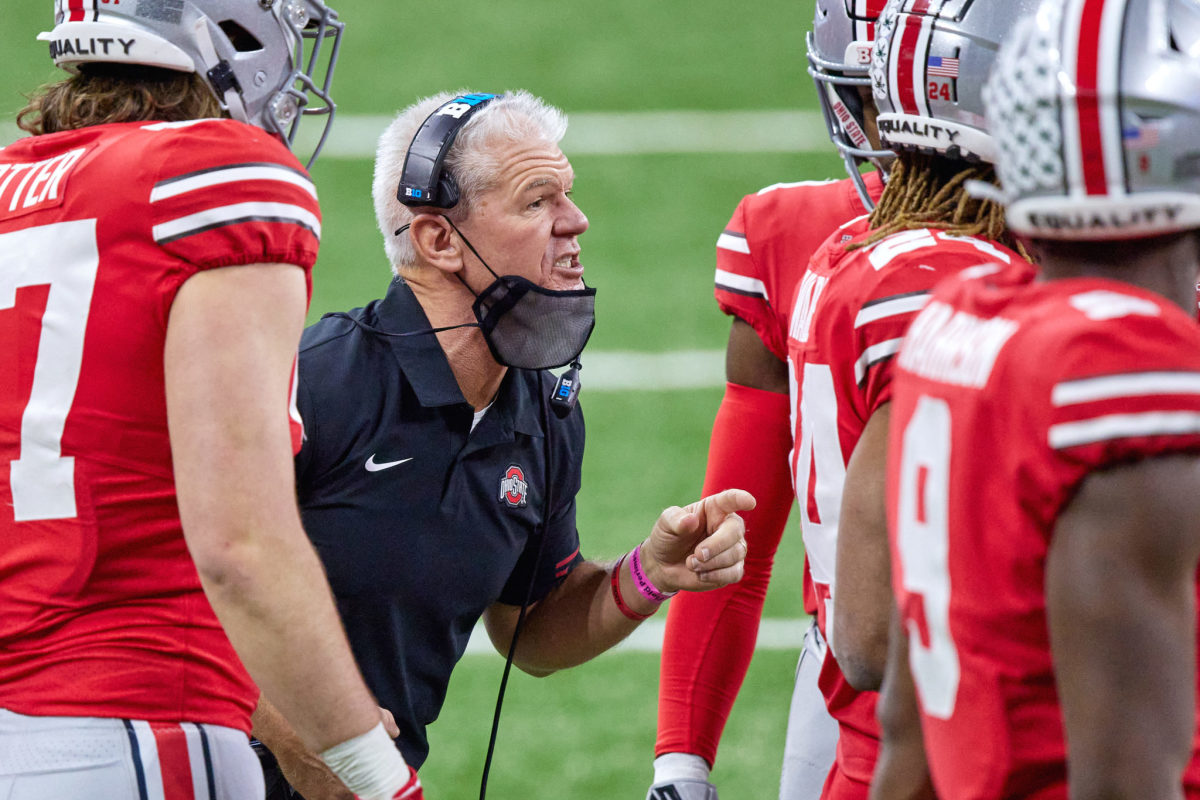 Ohio State defensive coordinator Kerry Coombs talks to players.