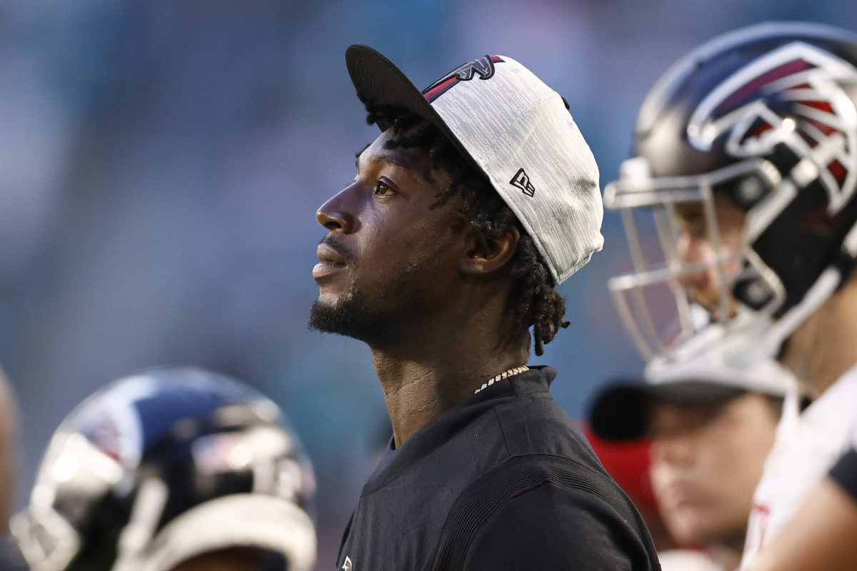 Falcons wide receiver Calvin Ridley looks on from the sidelines.