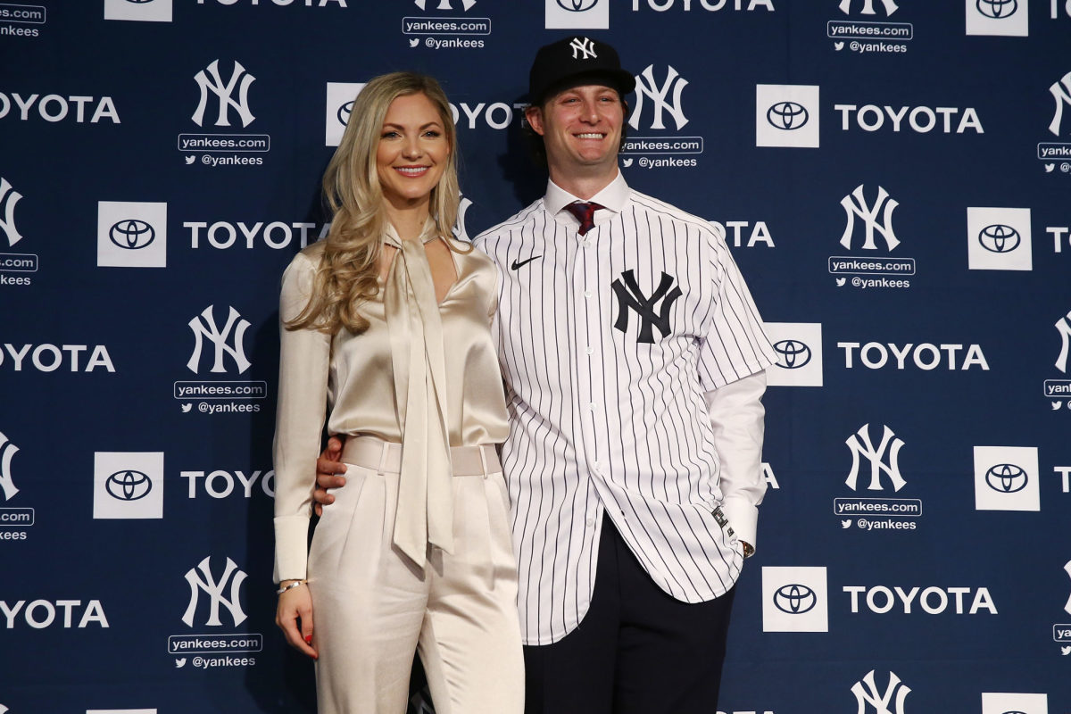 Manager Aaron Boone with Gerrit Cole and his wife Amy Cole as the New York  Yankees