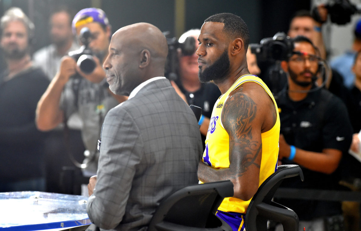 Lakers legend James Worthy speaks to LeBron James at the team's media day.