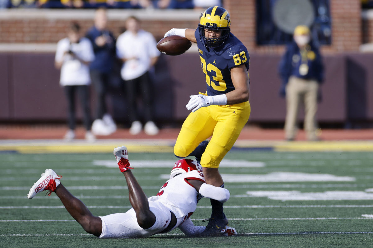 Michigan tight end Erick All tries to break a tackle.