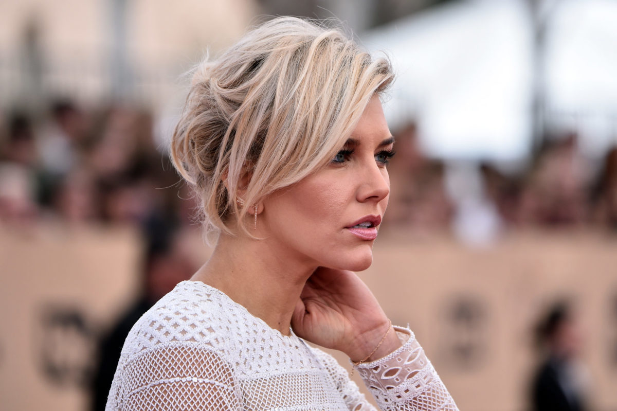 Charissa Thompson walks the red carpet before an awards show.