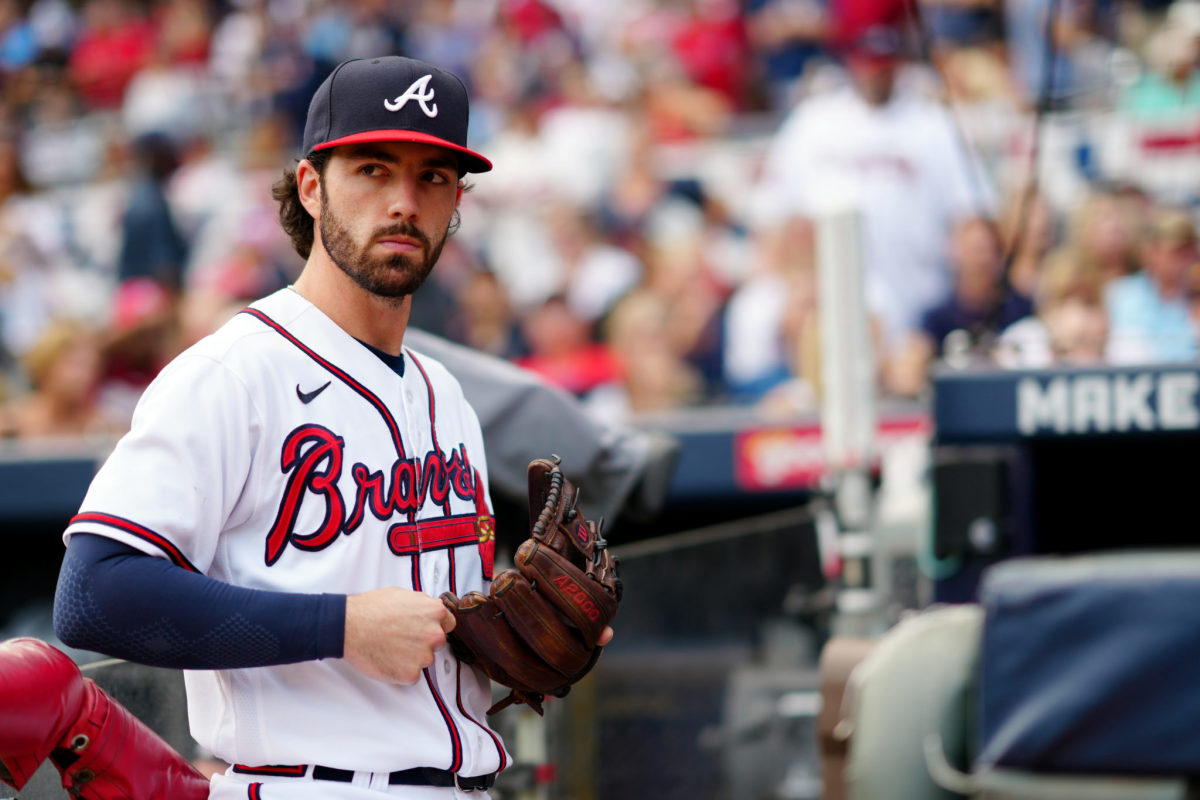 Dansby Swanson tightens his glove.