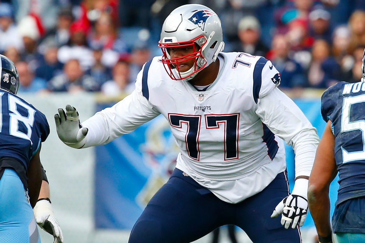 New England Patriots offensive lineman Trent Brown (77) stands on the  sidelines during an NFL football game against the Miami Dolphins Sunday,  Sept. 11, 2022, in Miami Gardens, Fla. (AP Photo/Doug Murray