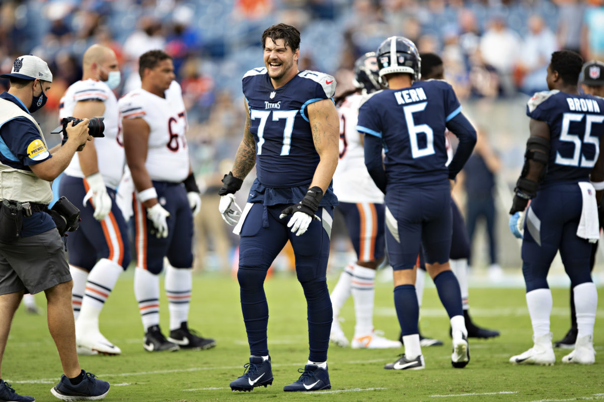 Tennessee Titans tackle Taylor Lewan on the field ahead of a game.