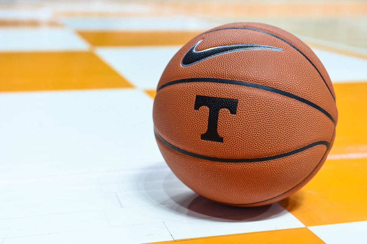 a basketball with the Tennessee logo rests on the court.