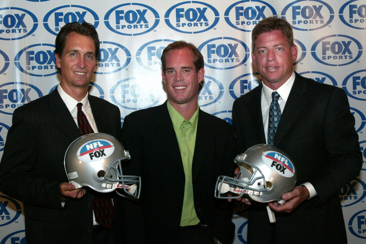 Cris Collinsworth, Joe Buck, and Troy Aikman during a press conference