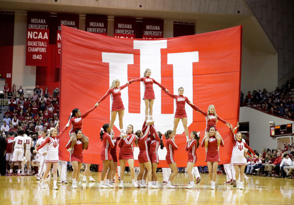 Indiana cheerleaders performing during a basketball game.