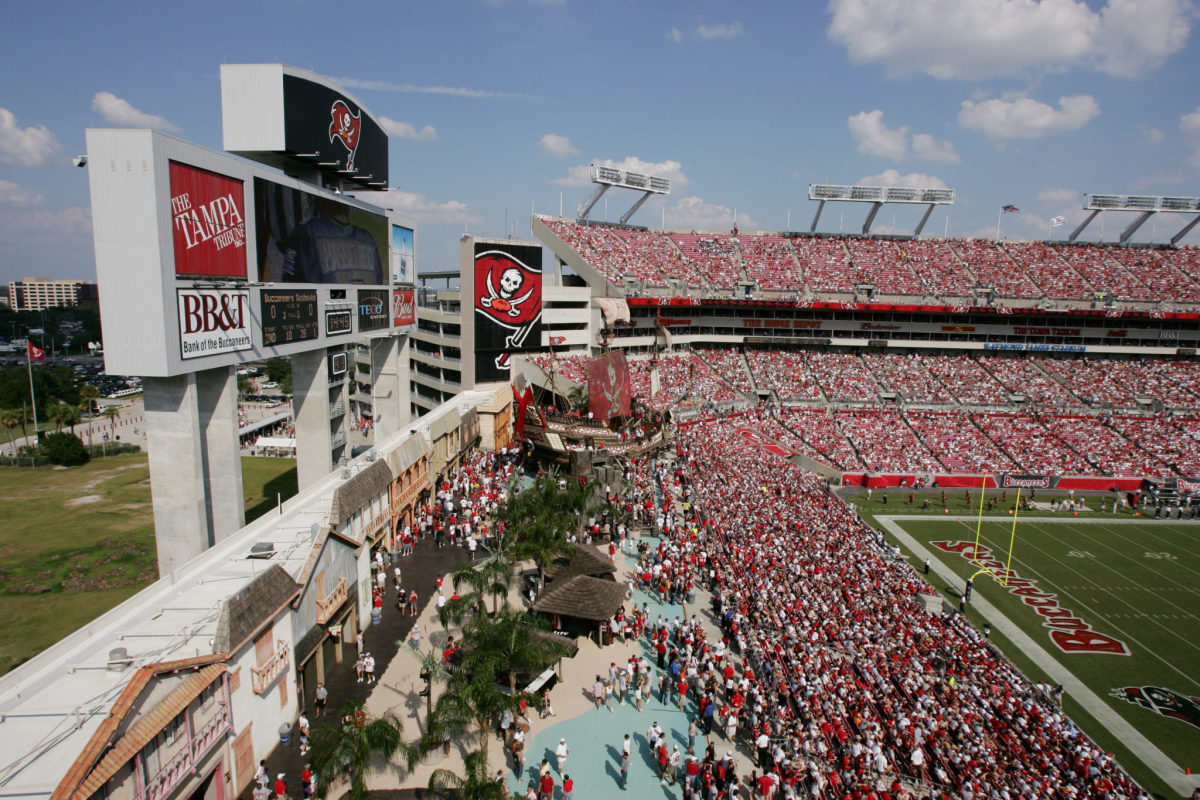 Tampa Bay Buccaneers fans react as a military flyover proceded over the  stadium at the conclusion of the national Anthem before an NFL football  game between the Tampa Bay Buccaneers and the