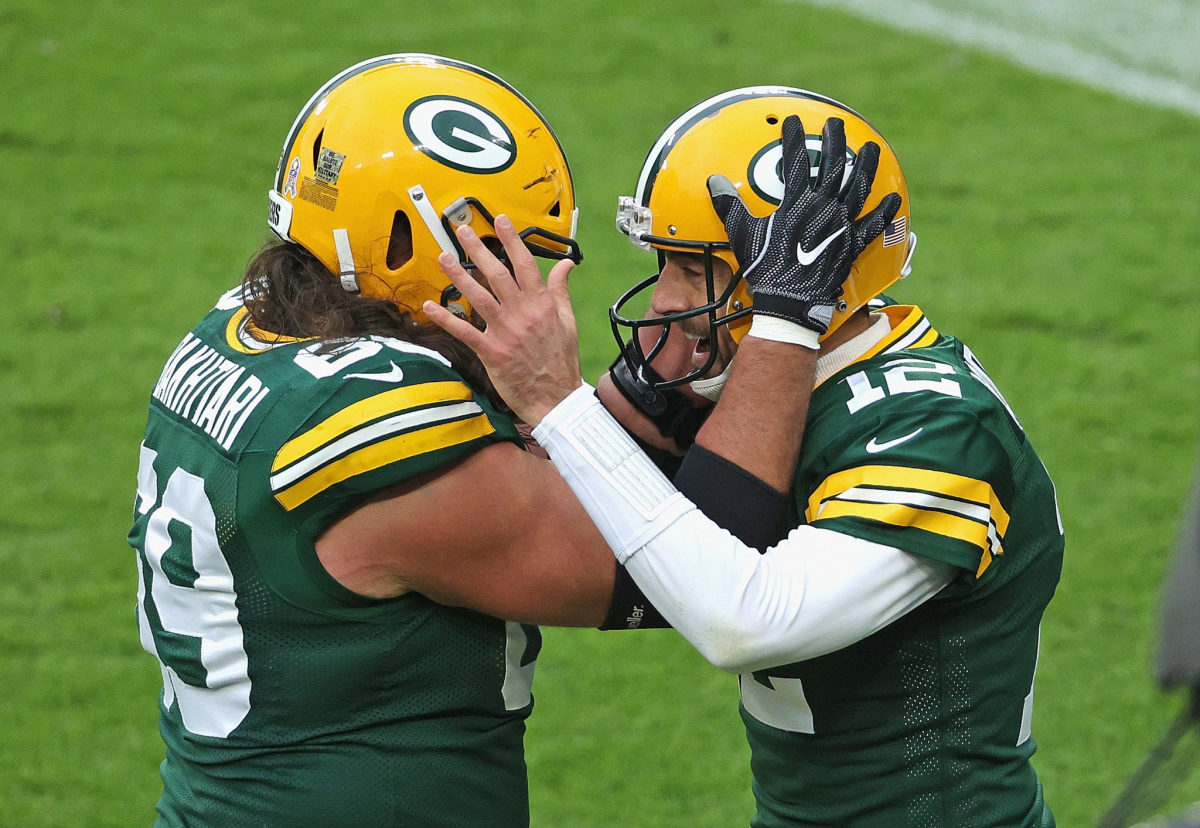 Aaron Rodgers celebrates with Green Bay Packers teammate David Bakhtiari.