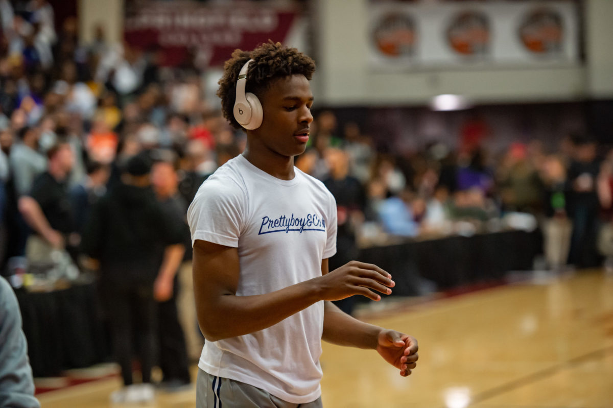 Bronny James warms up before a high school game.