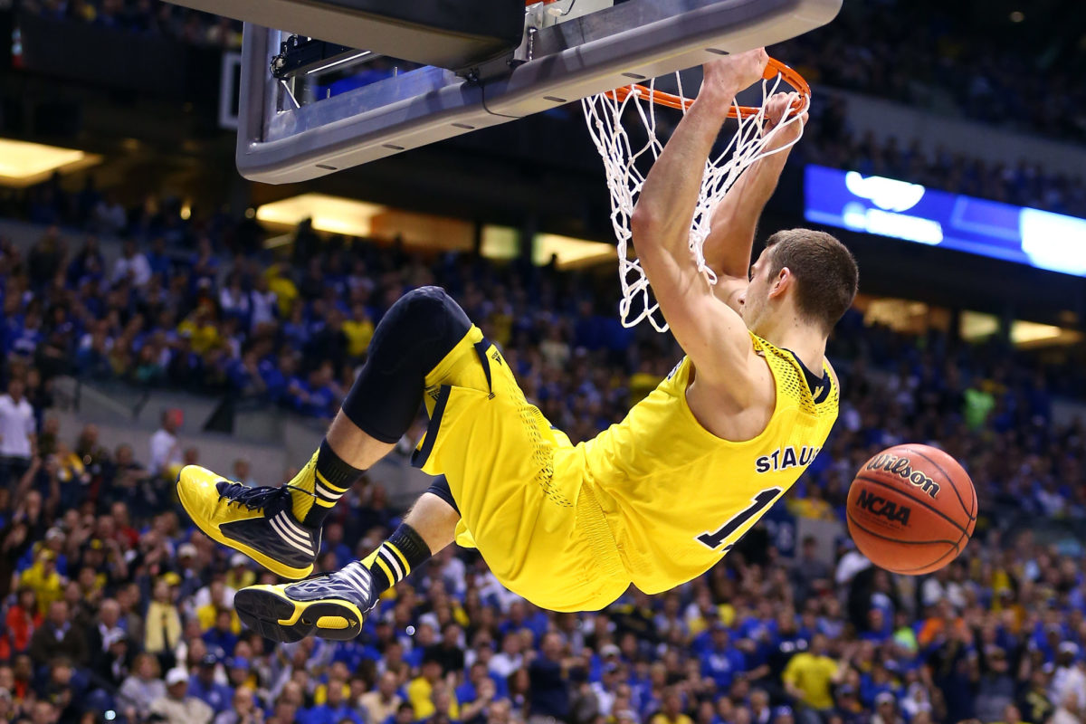 Nik Stauskas dunking the ball during a game for the Michigan Wolverines.