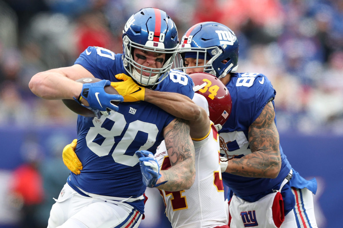 Giants tight end Kyle Rudolph gets tackled during a game.