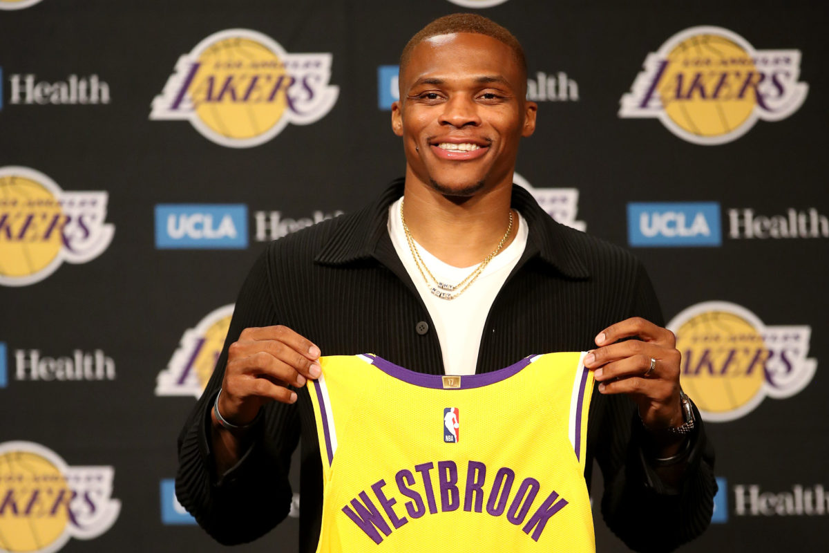 Russell Westbrook holds his Lakers jersey.