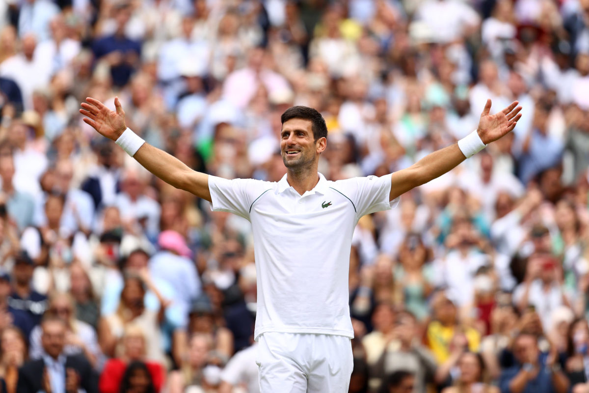 Novak Djokovic celebrates winning at Wimbledon.
