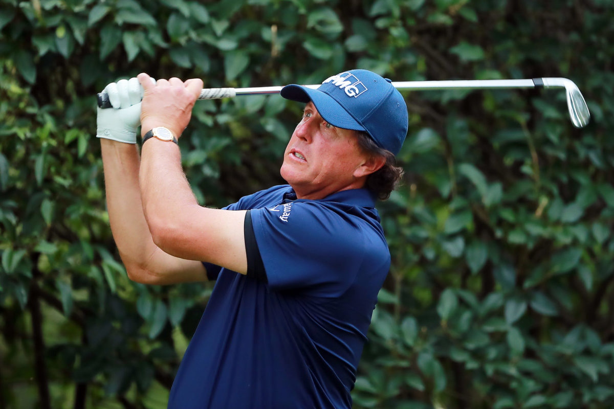 Phil Mickelson hitting a golf ball.