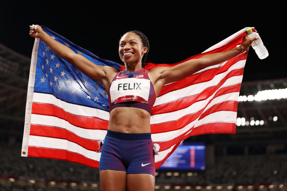 Allyson Felix celebrates her bronze medal.
