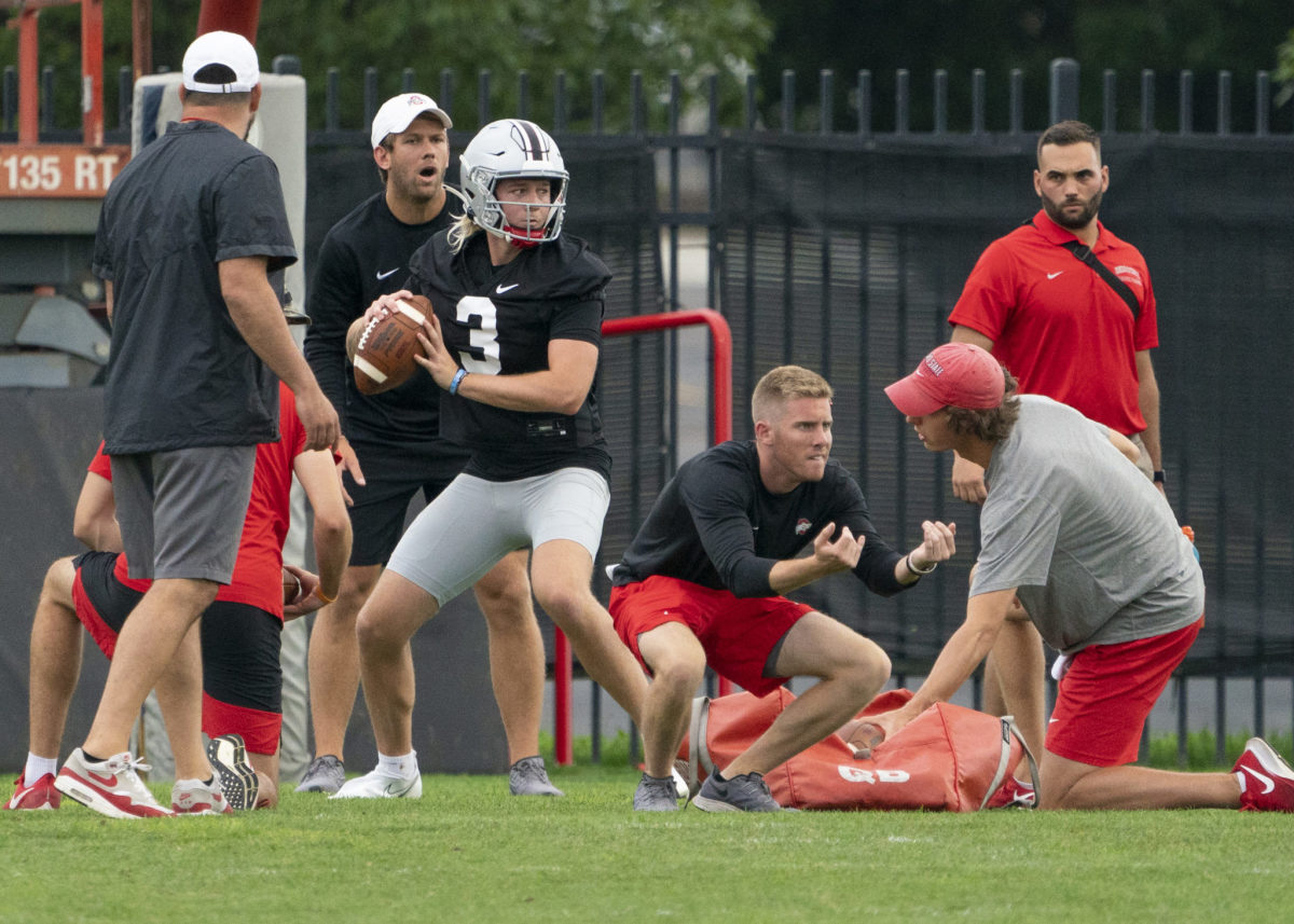 Quinn Ewers sets to throw during Ohio State football training camp.