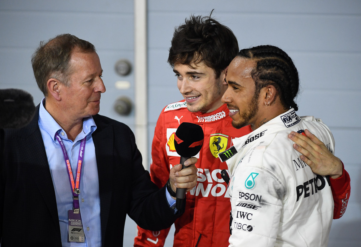 Formula 1 host Martin Brundle with Charles Leclerc and Lewis Hamilton following a race in 2019.
