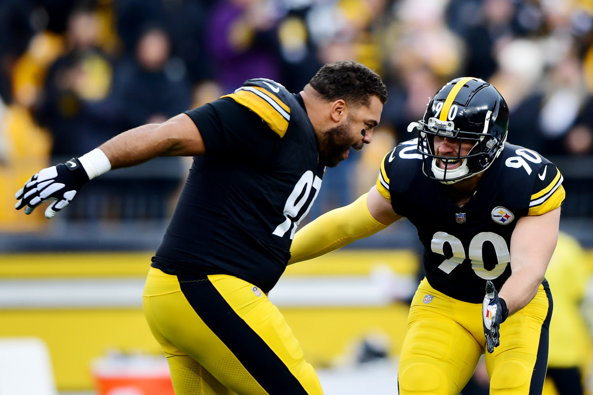 PITTSBURGH, PENNSYLVANIA - NOVEMBER 14: Cameron Heyward #97 high fives T.J. Watt #90 of the Pittsburgh Steelers as he runs onto the field for a game against the Detroit Lions at Heinz Field on November 14, 2021 in Pittsburgh, Pennsylvania. (Photo by Emilee Chinn/Getty Images)