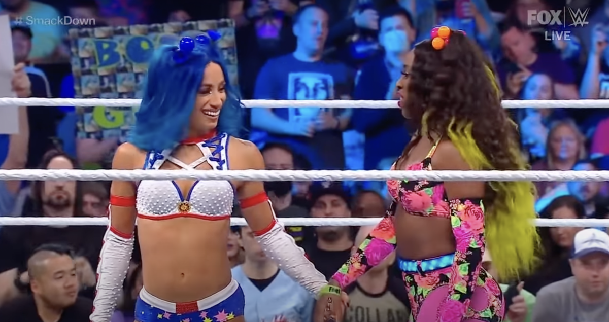 WWE stars Naomi and Sasha Banks at an event.