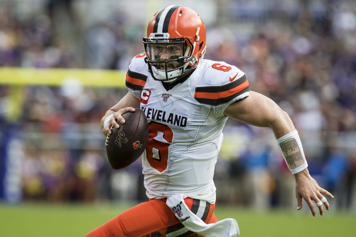 Cleveland Browns QB Baker Mayfield runs with the ball against the Baltimore Ravens.
