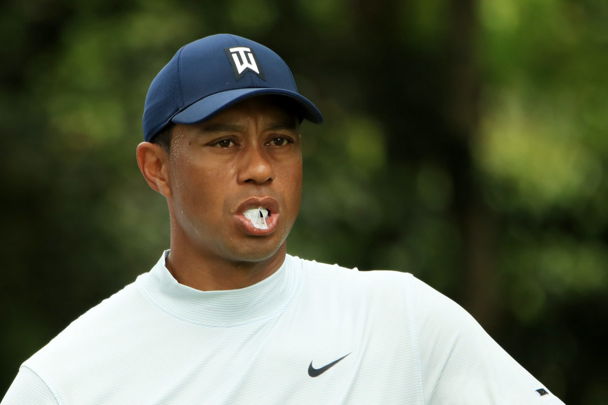 tiger woods chews gum at the masters