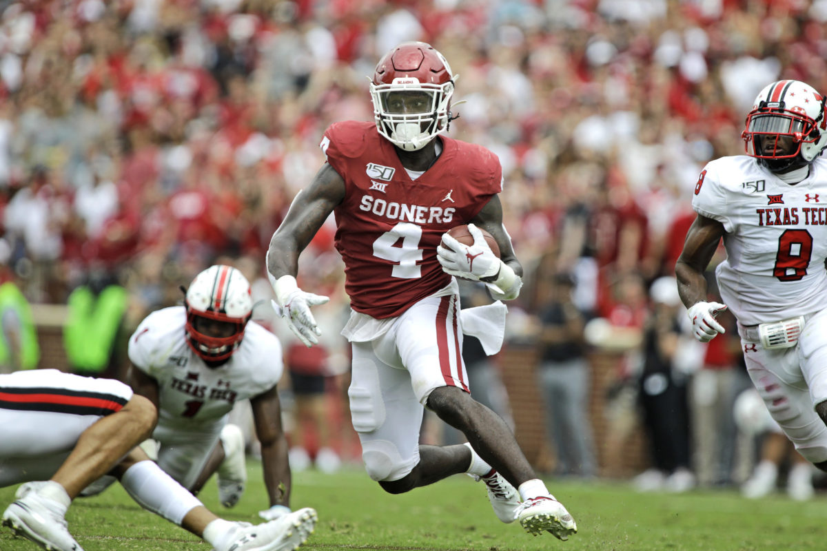 Oklahoma running back Trey Sermon carries the ball in a game.