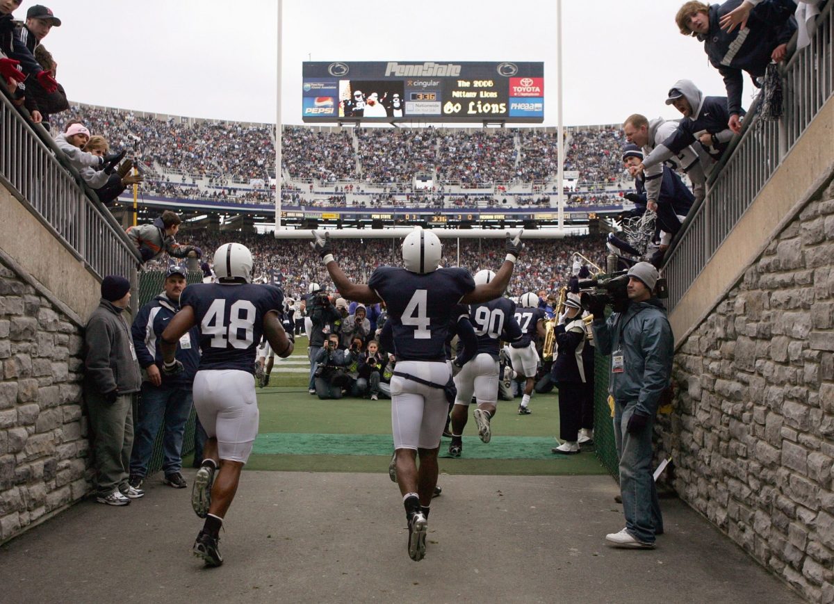 Penn State players run out onto the field.