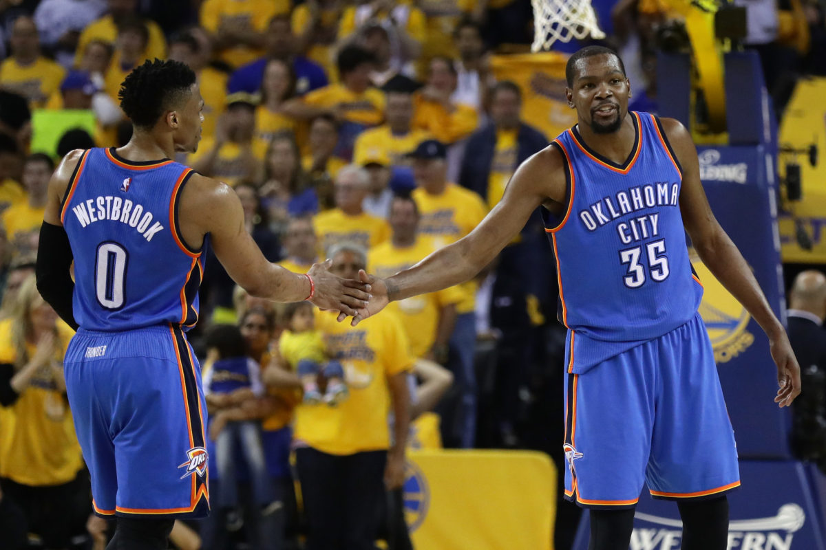 Russell Westbrook slapping hands with Kevin Durant