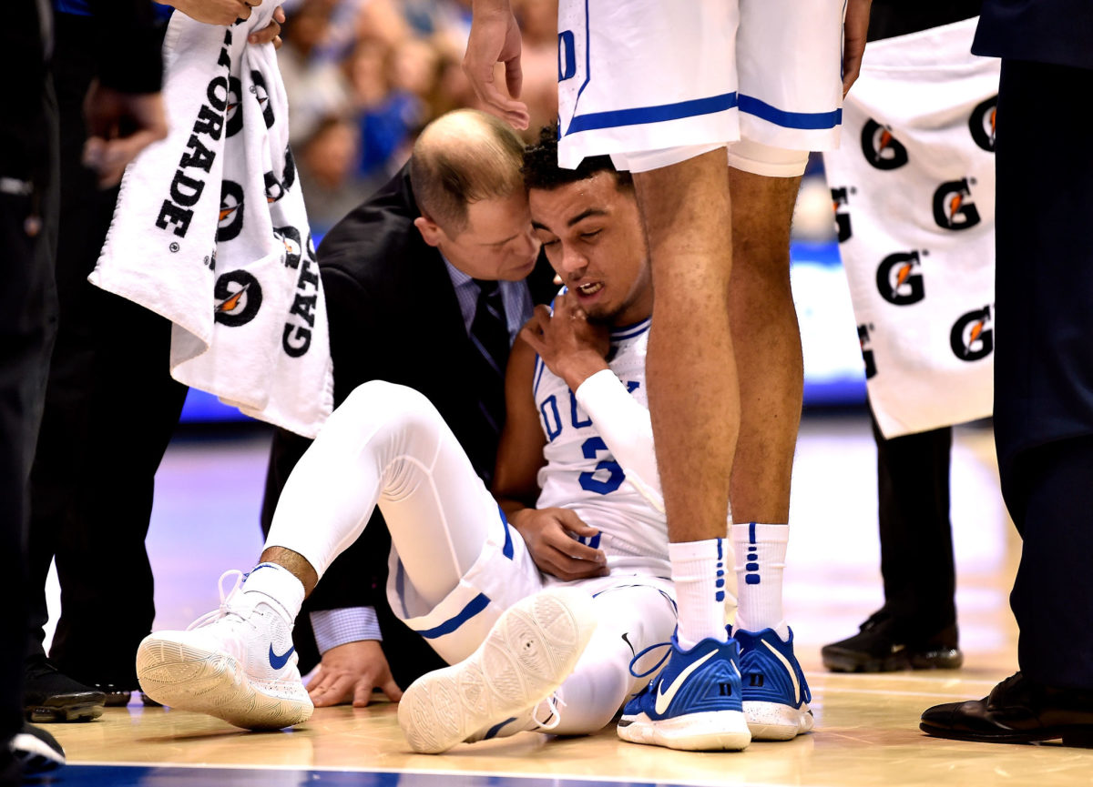 Tre Jones on the ground after getting hurt in Duke's loss to Syracuse.