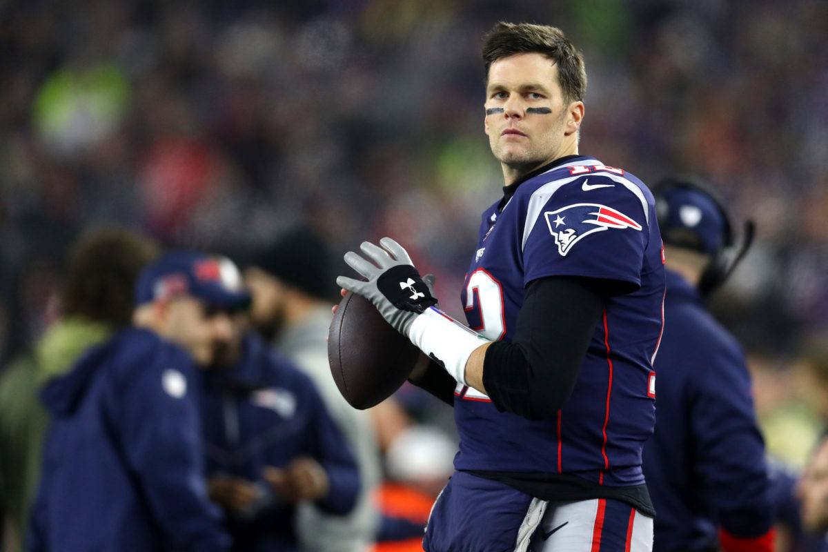 Patriots quarterback Tom Brady warms up before an NFL game.