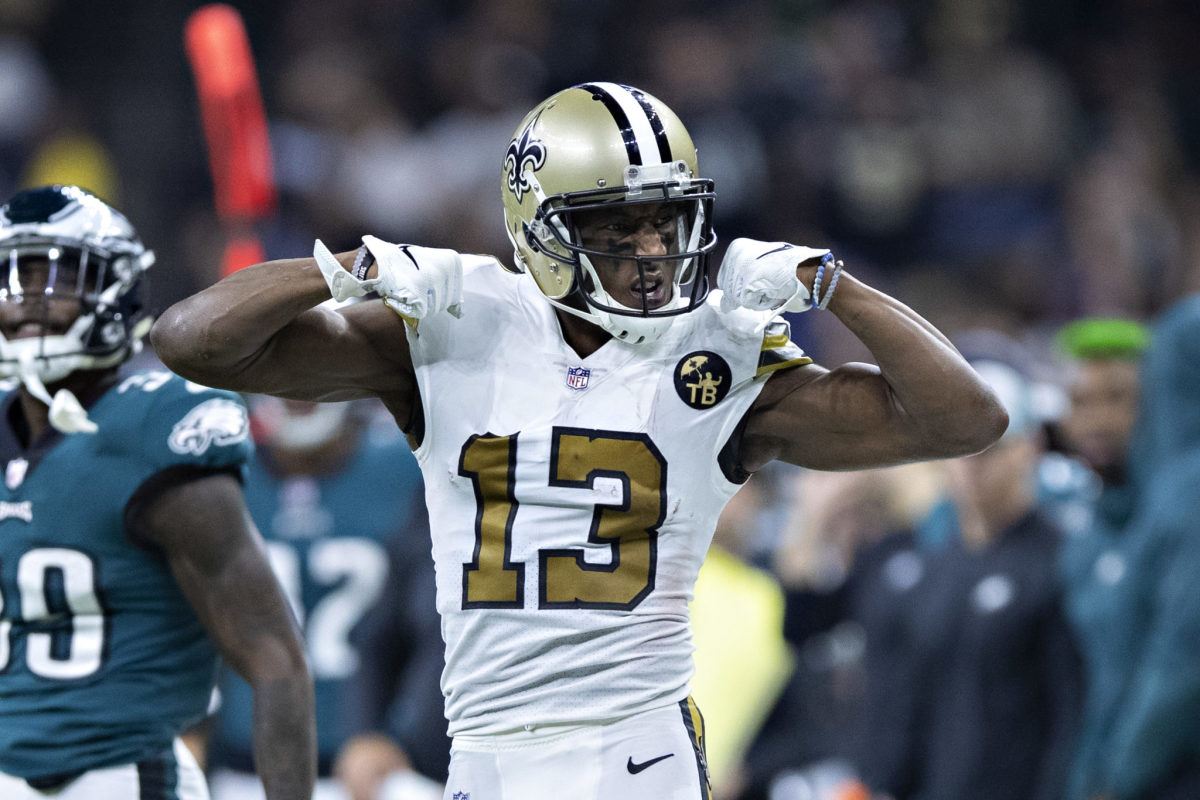 Michael Thomas flexing his biceps during a New Orleans Saints game.