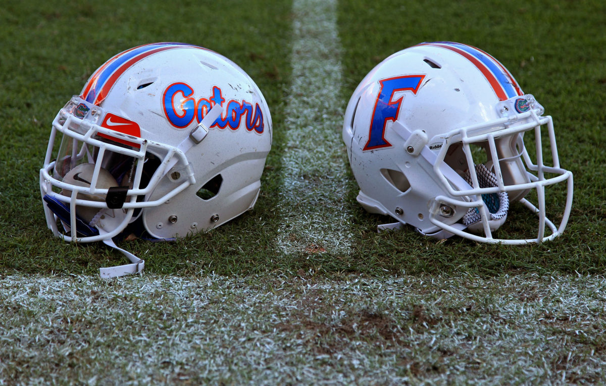 A closeup of two alternate Florida Gators football helmets.