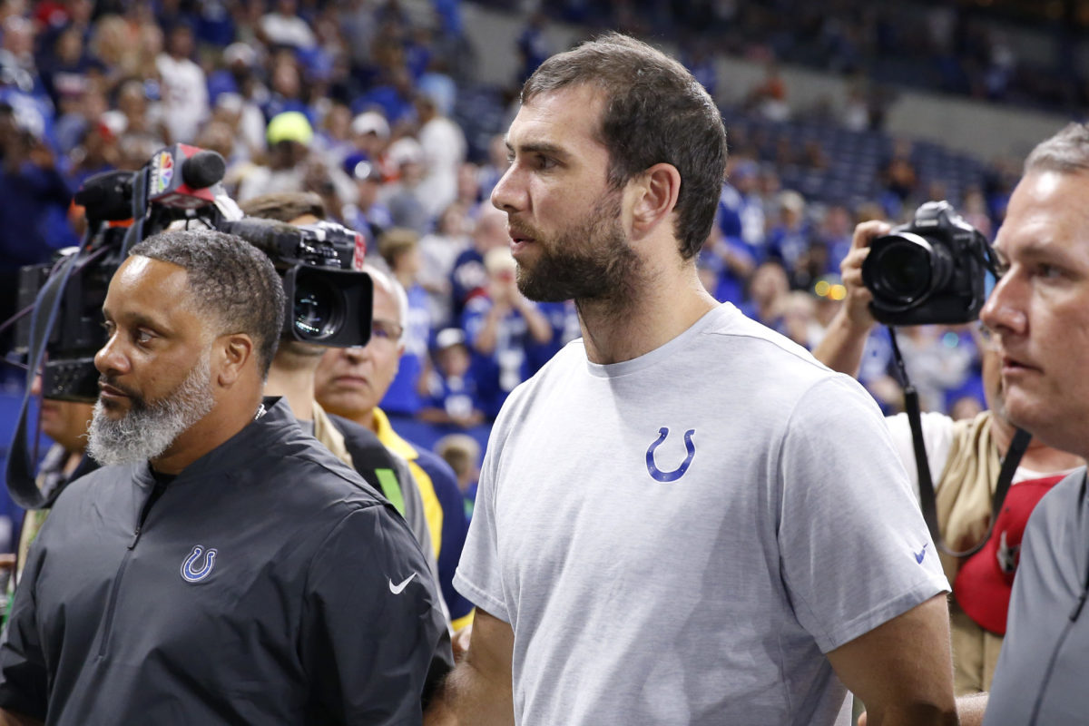 Andrew Luck walks off the field following his retirement.