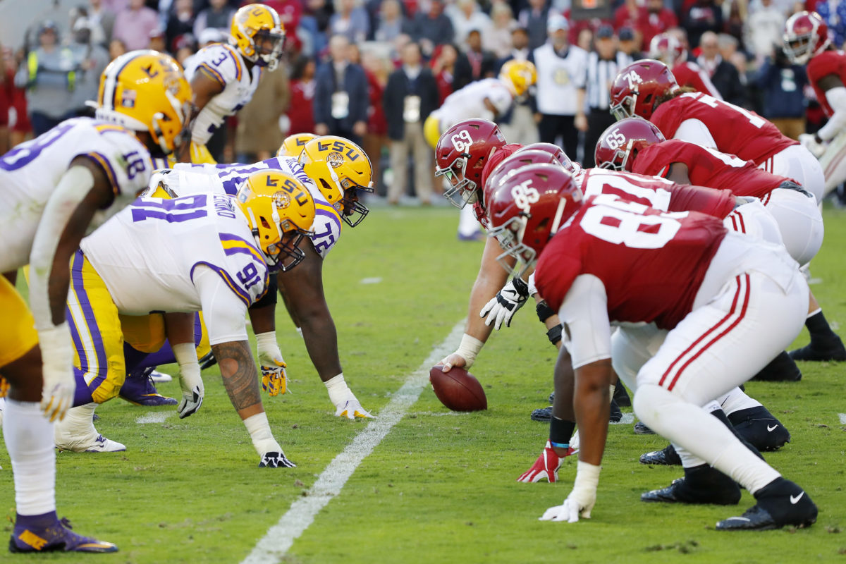 Alabama and LSU players line up during a huge SEC college football showdown at Bryant-Denny Stadium.