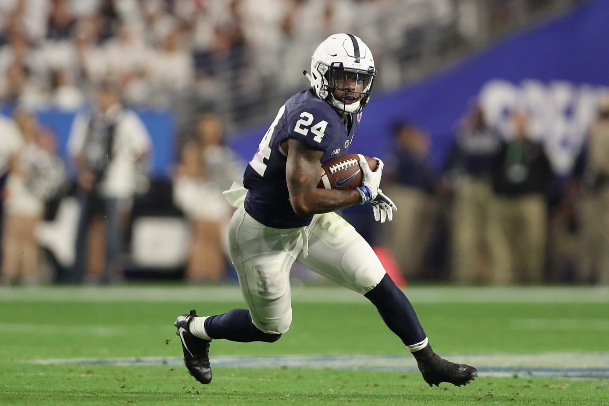 Miles Sanders runs with the ball for Penn State.