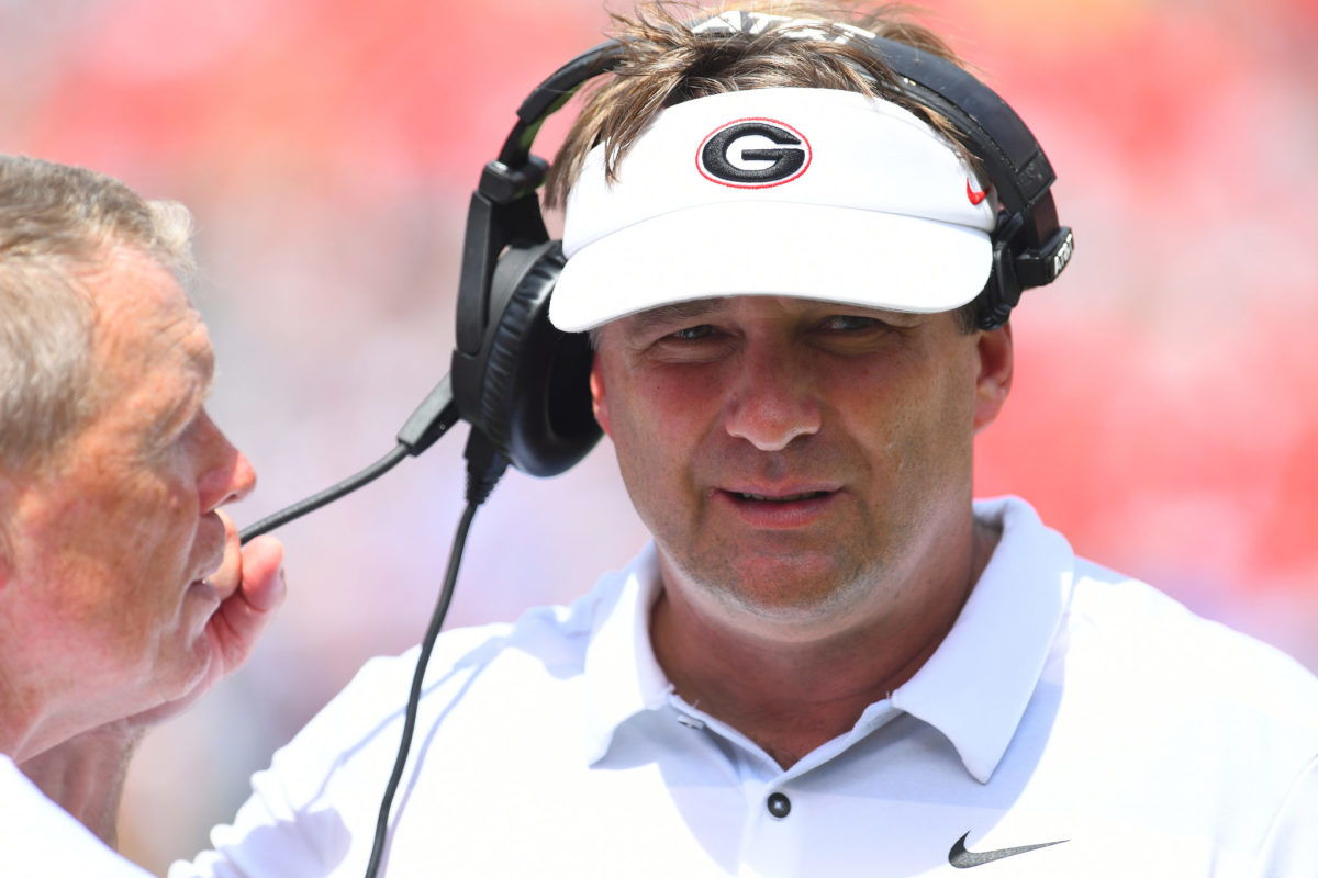 Kirby Smart talking to one of his Georgia assistants.