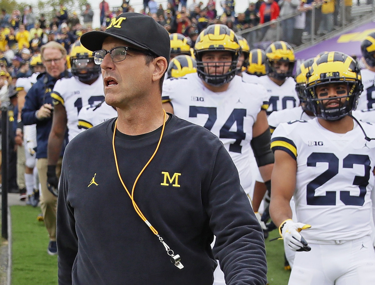 A closeup of Jim Harbaugh on the sideline prior to a Michigan football game.