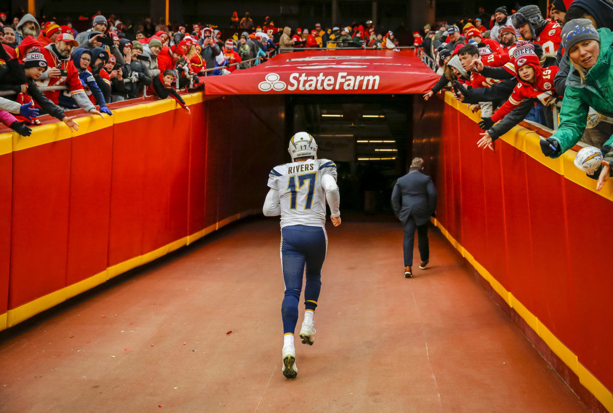 Philip Rivers runs off the field after a game in Kansas City.
