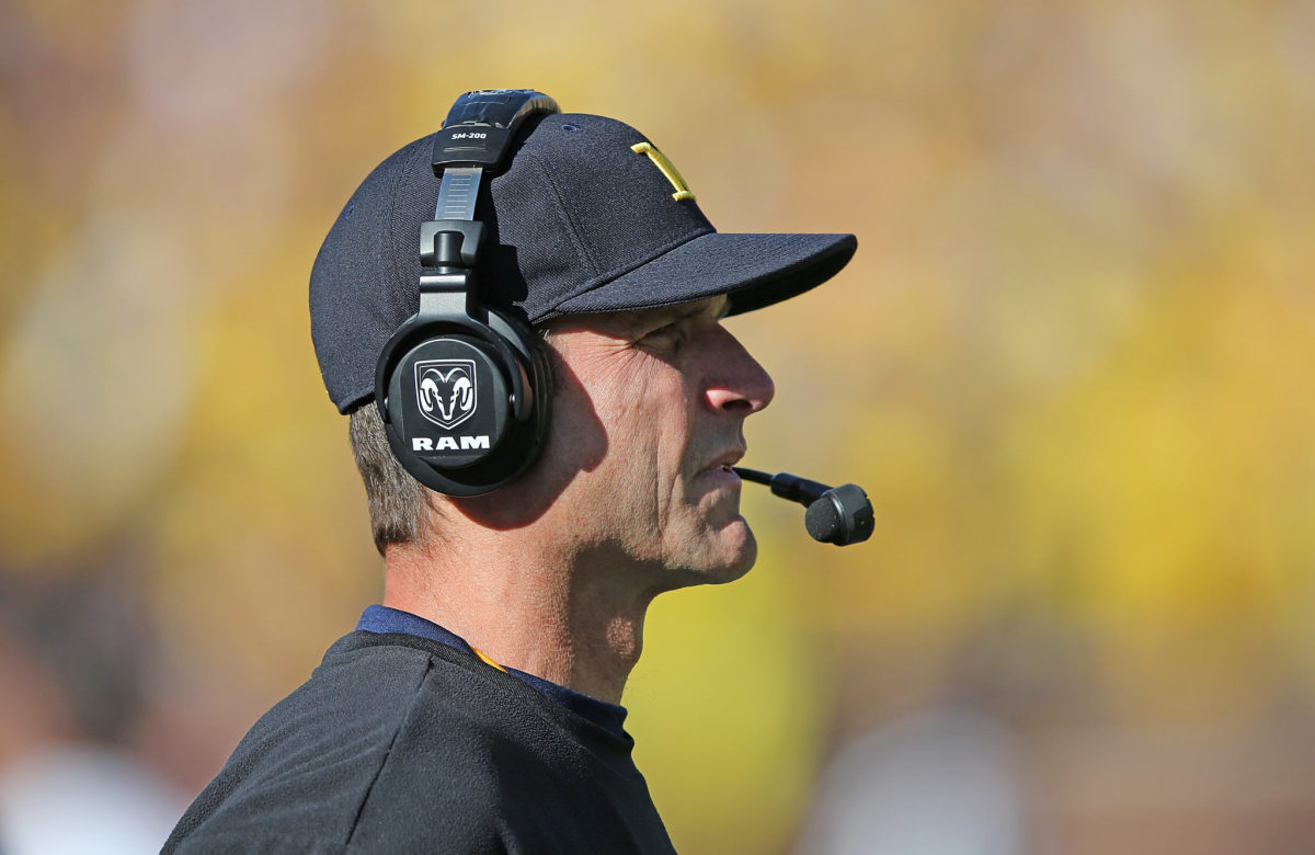 Michigan Wolverines head football coach Jim Harbaugh watches the action during the second quarter of the game against the Northwestern Wildcats.